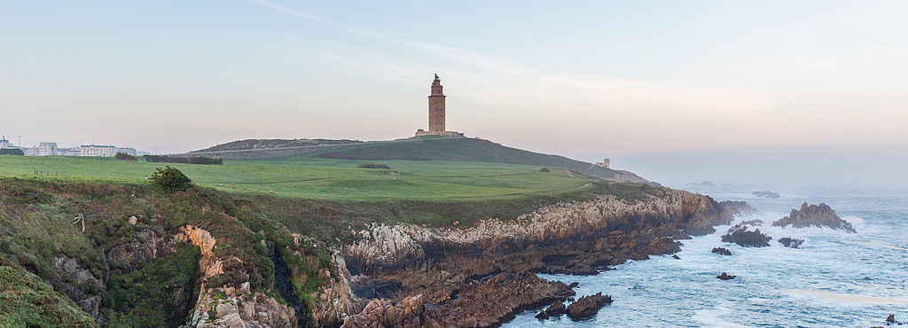 View of the Tower of Hercules (A Coruña) and the surrounding area during sunrise.